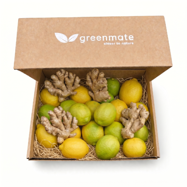 Box of lemons and ginger with 'greenmate' branding on a white background