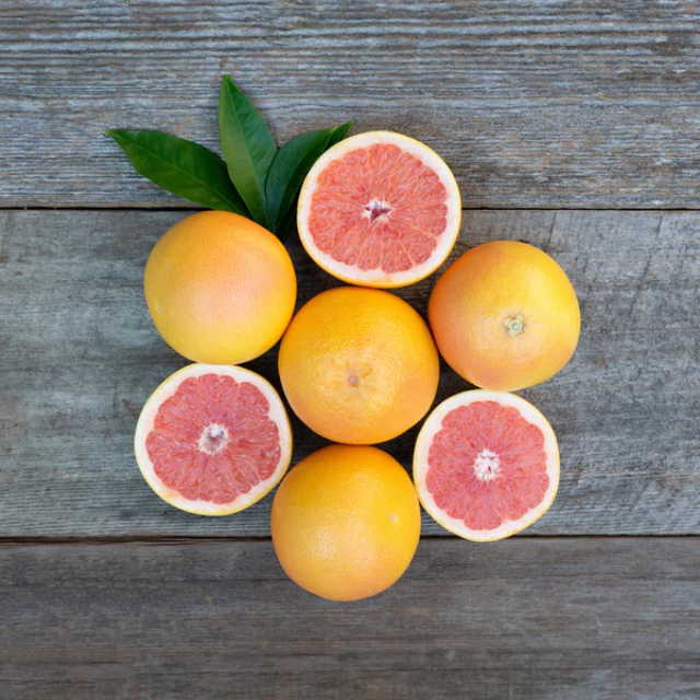 Some grapefruits on wooden floor